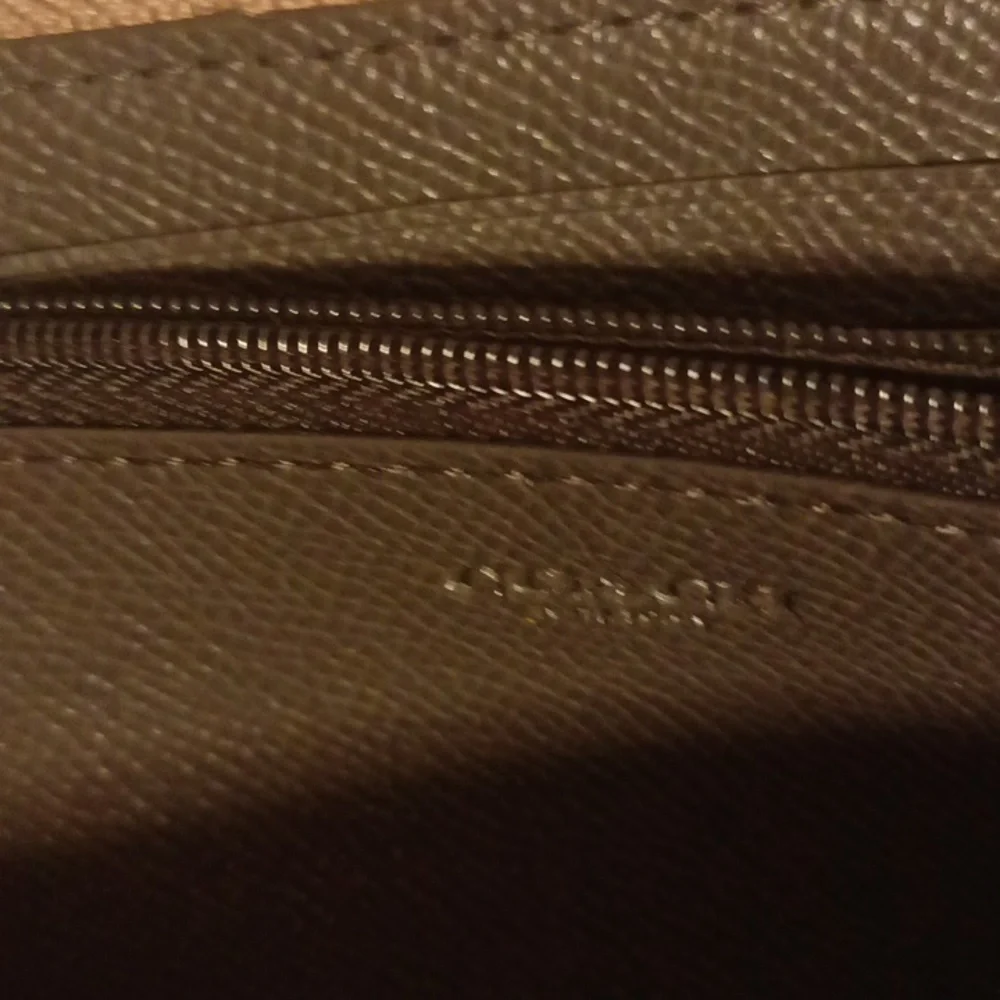 Coach gold pebbled leather accordion wallet